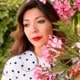 woman standing with flowers